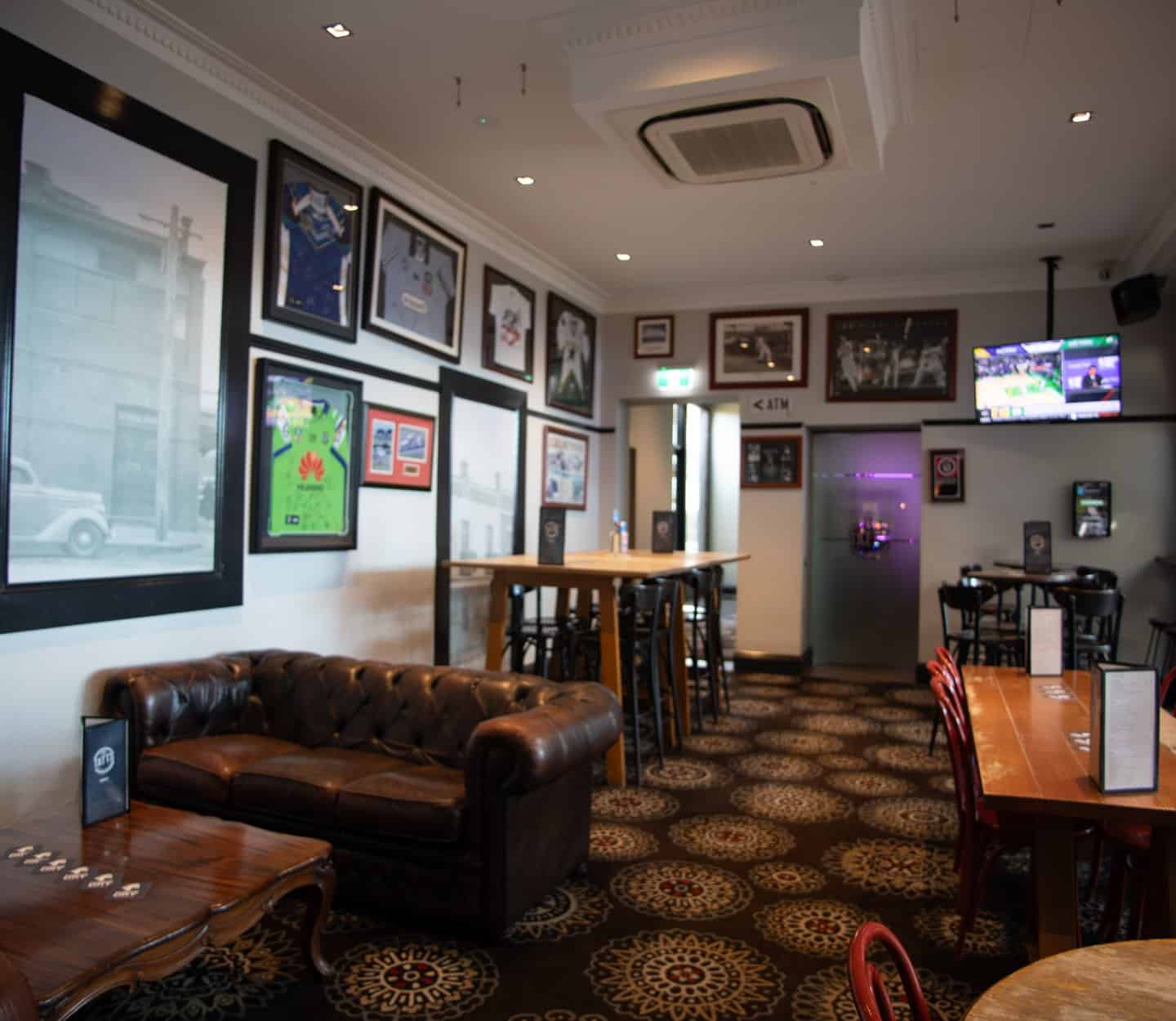 Lounge with chesterfield seating at The Tatts